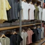 Assorted casual clothing on display in a modern retail store, ideal for shopping concepts and Back to School promotions